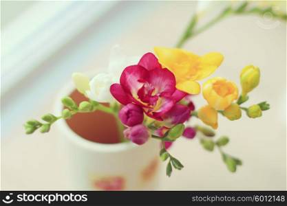 Home decor. Freesia flowers in a vase.