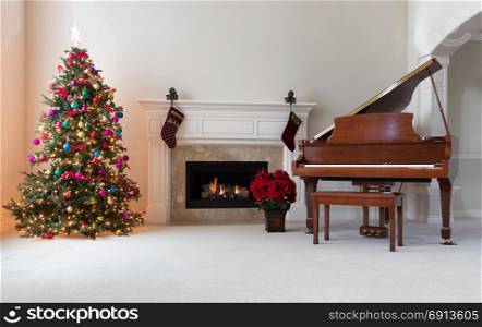 Home decorated for Christmas holiday season with glowing fireplace