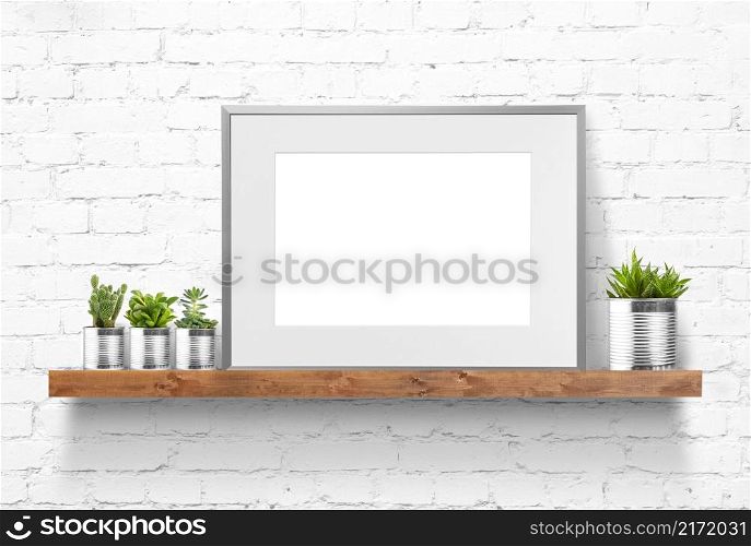 Home decoration with a framed poster on the table. Scandinavian style