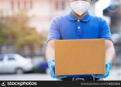 Home delivery man Wear a mask and gloves. Prevention of germs, the Covid 19 virus