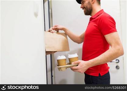 home, delivery service, mail and people concept - happy man delivering coffee and food in disposable paper bag to customer. delivery man with coffee and food at customer home