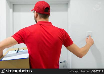home delivery service, mail, people and shipment concept - man with parcel box ringing customers door bell. delivery man with parcel box ringing door bell