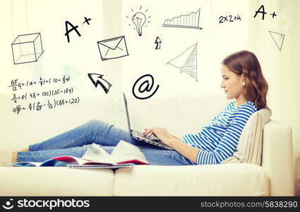home, education, technology and internet concept - busy teenage girl lying on the couch with laptop computer, book and notebooks at home