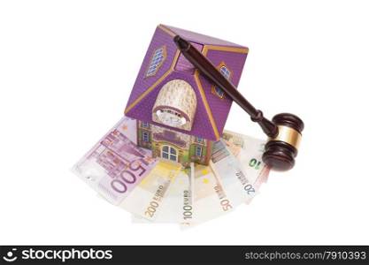 Home, euro money and gavel isolated on white.Real estate concept