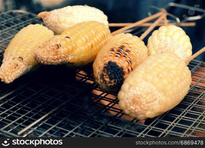 Home food for weekend, grilled corn on coal stove, a delicious, healthy snack food, hot corncob so nutrition