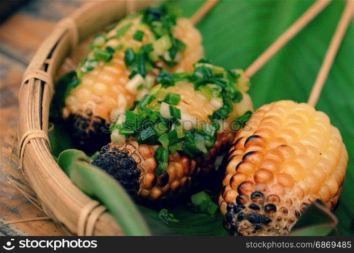 Home food for weekend, grilled corn on coal stove, a delicious, healthy snack food, hot corncob so nutrition