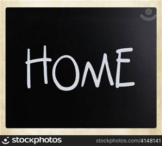 ""Home" handwritten with white chalk on a blackboard"