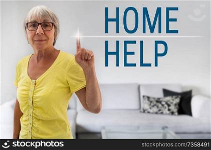 home help touchscreen is shown by Senior Woman.. home help touchscreen is shown by Senior Woman
