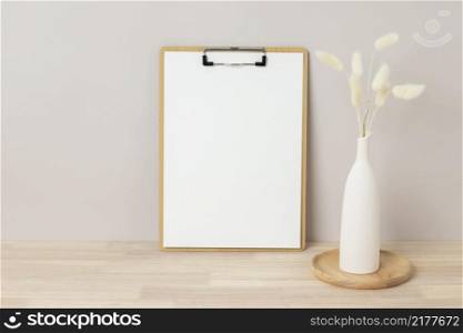 Home interior floral decor, pampas grass on table, Front view, clipboard, Greeting card Mockup. Beautiful white pampas grass in vase on white background