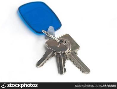 Home keys - set of three with a transparent blue holder. Isolated on white.. Set of keys