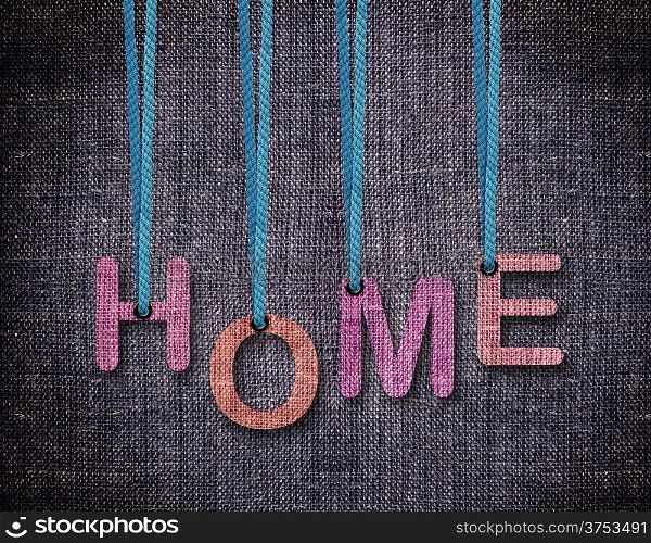 Home Letters hanging strings with blue sackcloth background.. Home