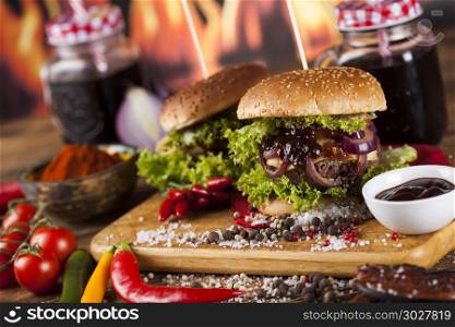 Home made burgers on wooden background. Fast food hamburge, wooden desk background