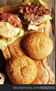 Home made cheeseburgers on rustic wooden table