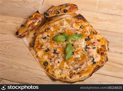 home made hot pizza on wooden table