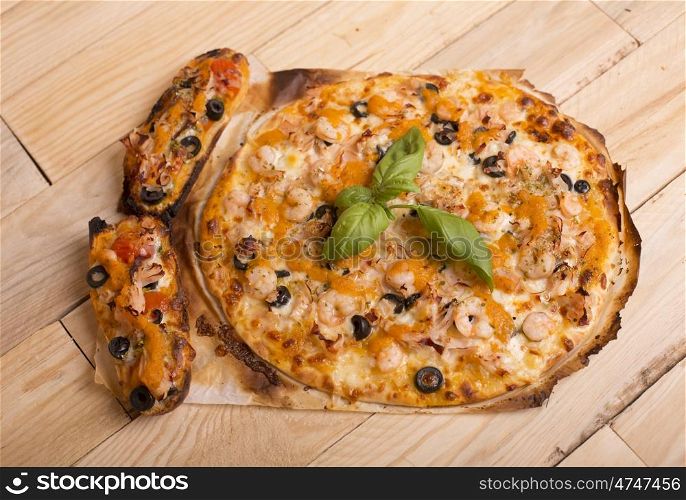 home made hot pizza on wooden table