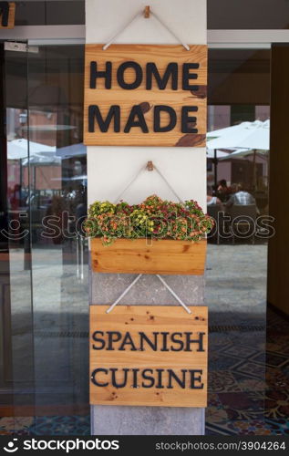 Home made spanish cuisine sign on entrance of restaurant. Home made spanish cuisine sign on restaurant door