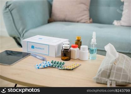 Home medicine with medicine package box free first aid kit with pills from pharmacy hospital delivery service at home on table in living room,  online purchase delivery of medicines to your home