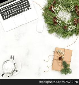 Home office working place with Christmas decoration and wrapped gift. Top view Flat lay