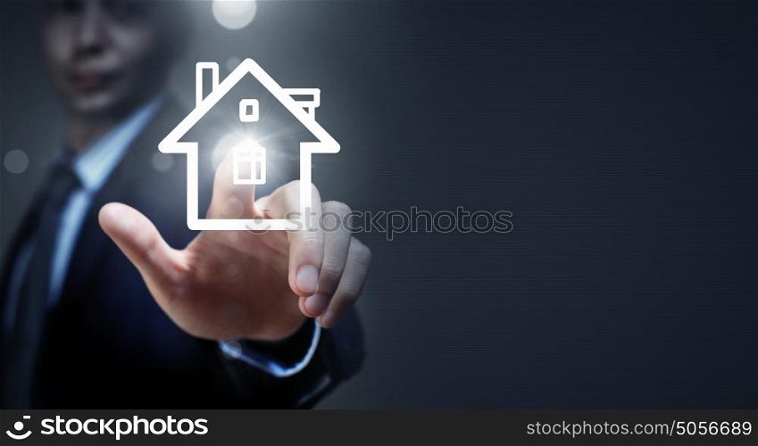Home on hand. Close up of businessman hand holding house model
