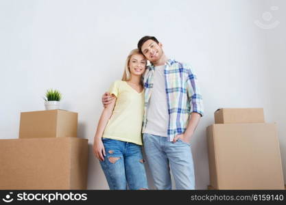 home, people, repair and real estate concept - smiling couple with big cardboard boxes moving to new place