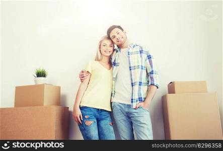 home, people, repair and real estate concept - smiling couple with big cardboard boxes moving to new place. smiling couple with big boxes moving to new home