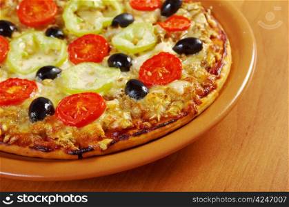 .home pizza with tomato and eggplant Closeup