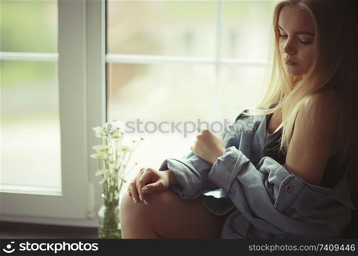 Home portrait of a young blonde girl