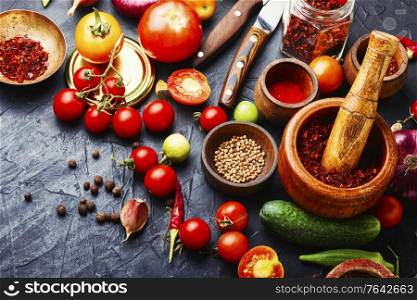 Home preservation of vegetables.Harvest of tomatoes and cucumbers for pickling.. Assortment of preserved vegetable