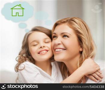 home, real estate and family concept - mother and daughter with eco house