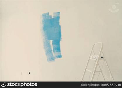 home renovation concept - old flat during restoration or refurbishment with blue paint stains. home renovation concept