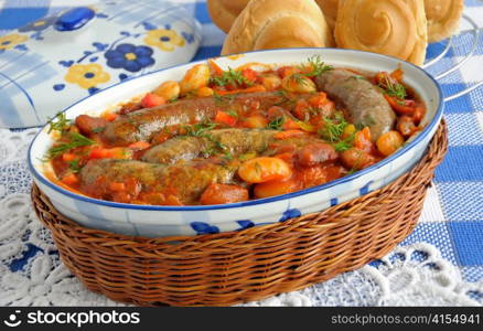 Home sausage with beans, onions and carrots in a tomato sauce