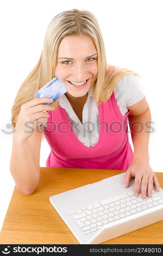 Home shopping - young woman holding credit card on white background