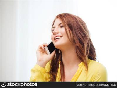 home, technology and communication concept - smiling teenage girl with smartphone at home