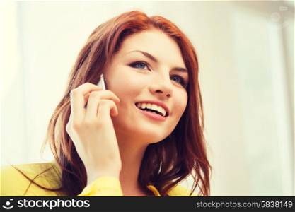 home, technology and communication concept - smiling teenage girl with smartphone at home