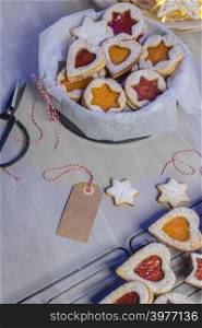 Homebaked Christmas Cookies With fruit Jam filling and Icing Sugar.