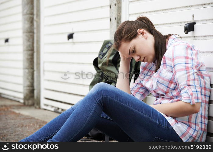 Homeless Teenage Girl On Streets With Rucksack