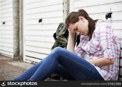 Homeless Teenage Girl On Streets With Rucksack