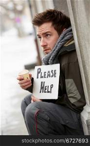 Homeless Young Man Begging In Street