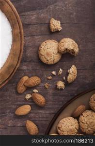 Homemade almond biscuit cookies with nuts and bowl with sugar