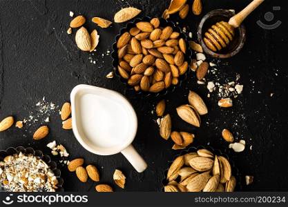 Homemade almond milk in jug. Almond milk and almonds