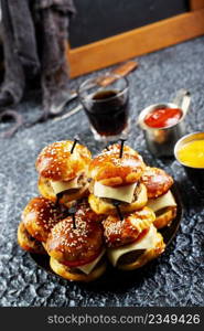 homemade beef burgers with cheese on serving board