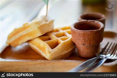 Homemade Belgium waffles served on a plate. Selective focus.