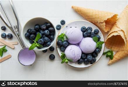 Homemade blueberry  ice cream with fresh blueberries. Sweet berry summer dessert. 