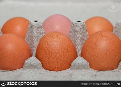 Homemade brown chicken eggs in an eco-friendly carton. Homemade brown eggs in an eco-friendly carton