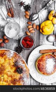 Homemade cake in a rustic style. Rustic pie with quince and jam with spices