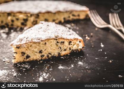 Homemade cake on a background with icing sugar