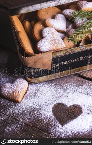 homemade cakes for Valentine's Day - girl holding a retro box with gingerbread cookies in the shape of a heart