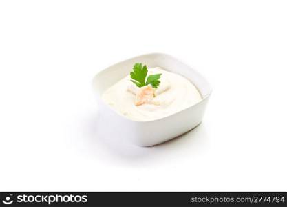 homemade cheese sauce with parsley leaf on white background