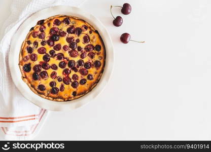 Homemade cherry cheesecake pie on white background. Top view