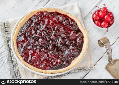 Homemade cherry jam tart on the wooden table